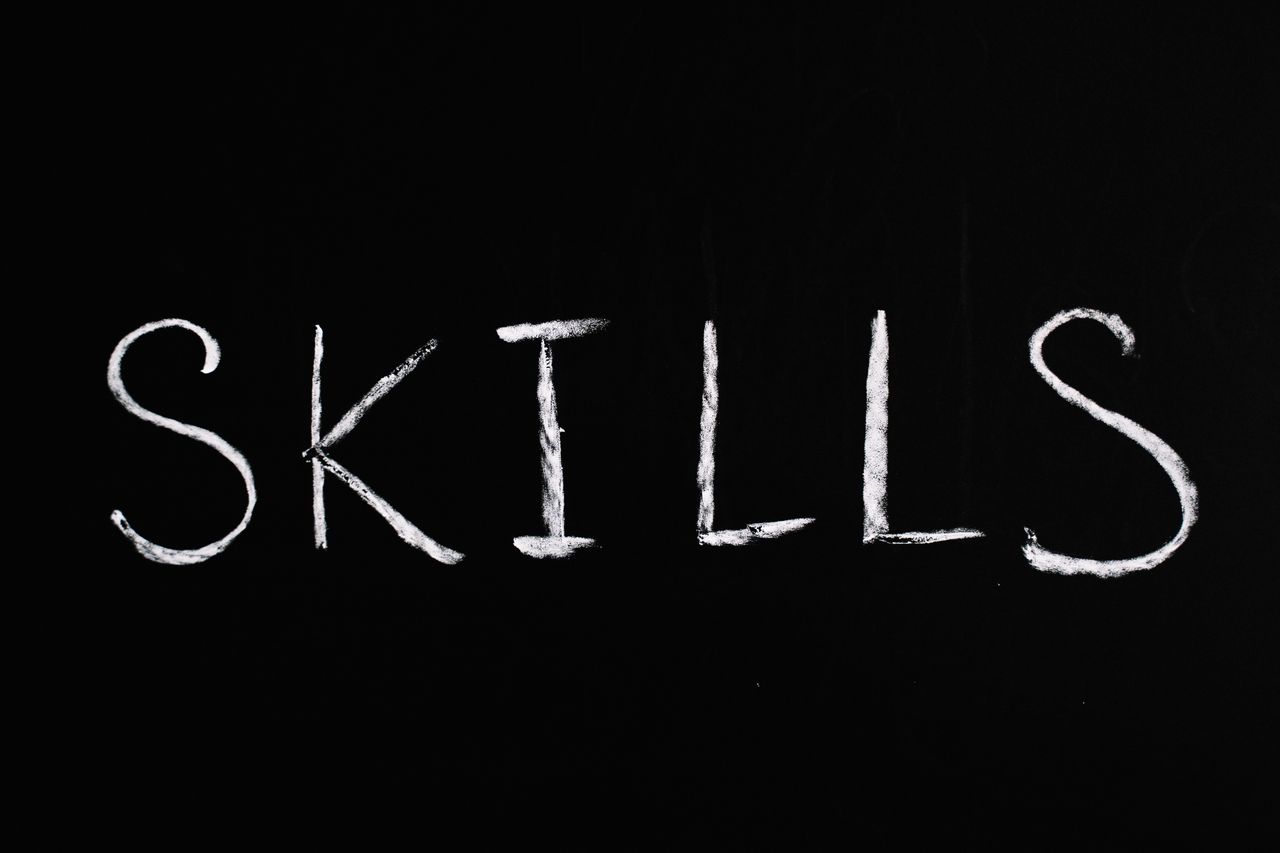 creative-approach-img Chalk lettering of the word skills on a blackboard, emphasizing learning and education.